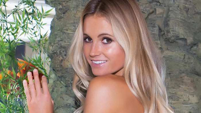 Alana Blanchard smiles over her shoulder at the camera.